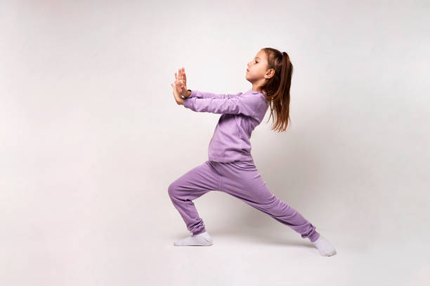 istock Young girl gymnast on white background 1476028142