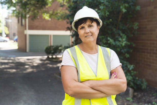 istock Female Industrial Worker. Road, construction site, waste 1476029695