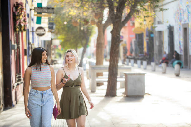 istock friends walking through the city 1476035880