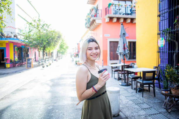 istock Young woman drinking coffee 1476037557