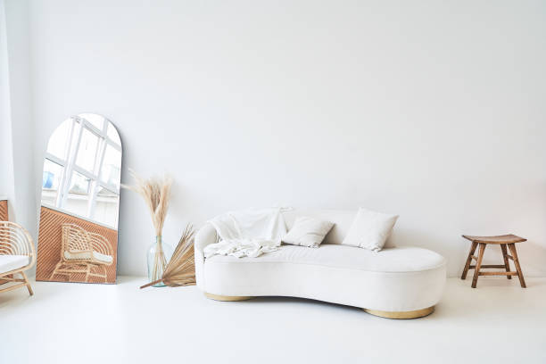 istock Modern, white minimalist interior. Modern interior design for posters in the living room layout with a white sofa with space to copy. High quality photo 1476041427