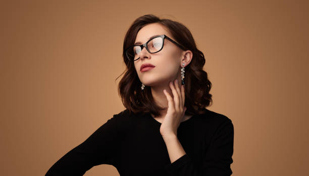 istock Elegant young woman touching neck 1476041535