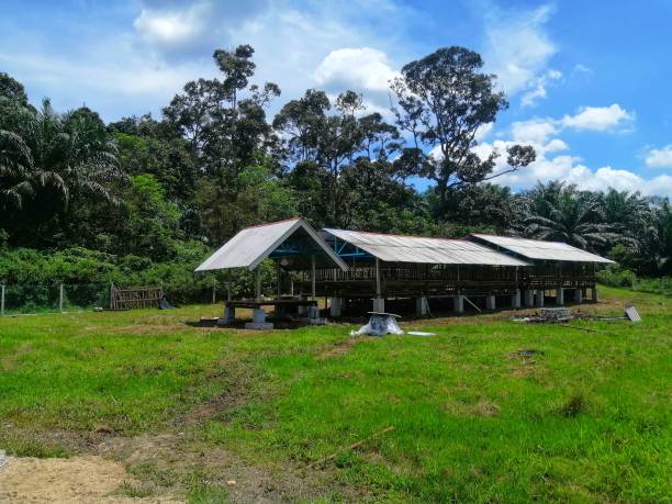 istock goat barn or pen  from afar at rural area. 1476053088
