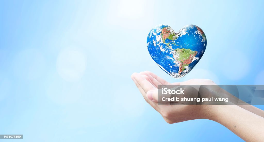 world health day and global health care concept,Holding Earth in heart shape hands against natural background, Elements of this image furnished by NASA World Health Day Stock Photo