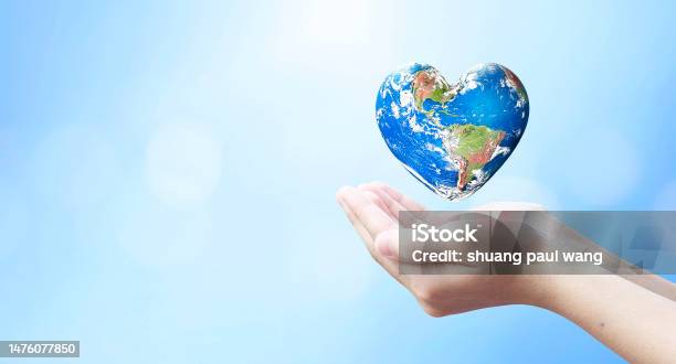 World Health Day And Global Health Care Conceptholding Earth In Heart Shape Hands Against Natural Background Elements Of This Image Furnished By Nasa Stock Photo - Download Image Now