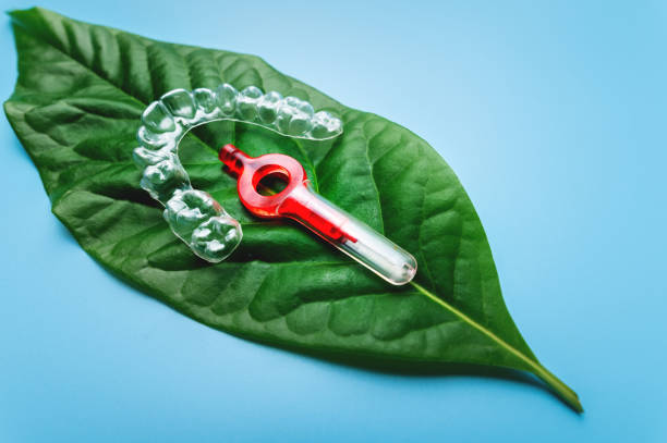 istock Invisible dental braces for teeth, teeth aligners, plastic braces, retainers for teeth straightening and care with interdental brush. Orthodontic Temporary Removable Straighteners 1476078397