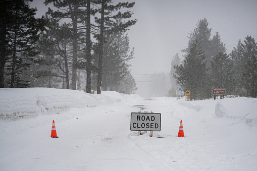 Road closed in the Sierra Nevada mountains during a winter storm.