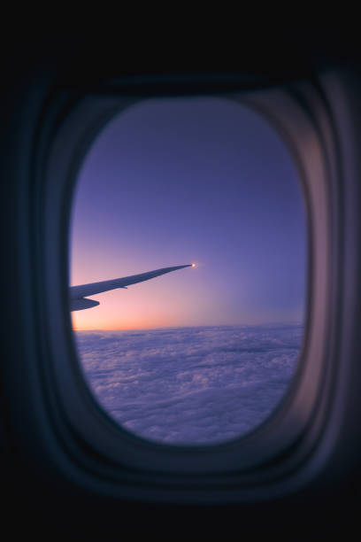 istock View from window of airplane during flight above clouds 1476088898