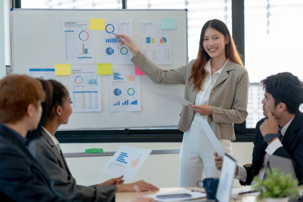 istock Group of young Asian business creative development planning strategy meeting and presentation at company sales strategy marketing conference. 1476090779