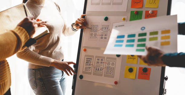 istock Programmers are meeting to make mobile app systems more modern and easier to use and meet the needs of the modern age. 1476091268
