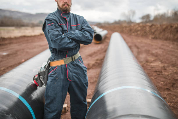 istock A gas pipeline worker stands with his arms crossed 1476096541