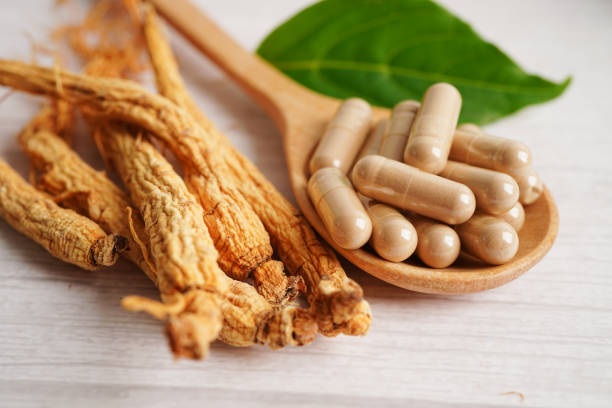 istock Ginseng roots and green leaf, healthy food. 1476097078