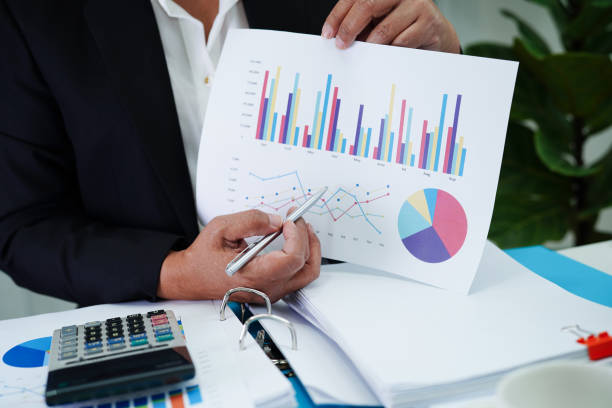 istock Business woman working and analysis with statistic graph in office. 1476099163