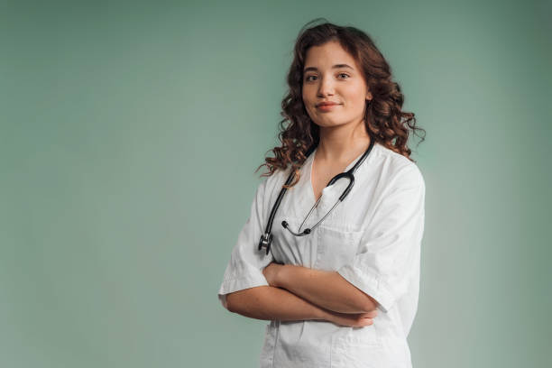 istock Portrait of young curly nurse, studio shoot. 1476106117