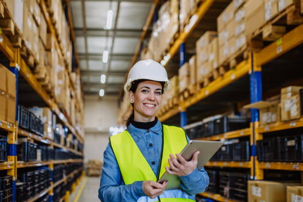 istock Warehouse female worker checking up stuff in a warehouse. 1476108237