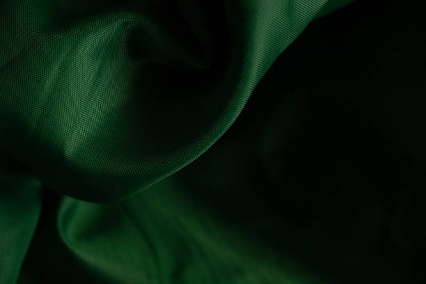 istock dark green crumpled fabric as background close up 1476110584
