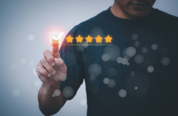 istock Satisfaction survey and customer service concept, businessman using a smartphone to answer the questionnaire and give a satisfaction rating, offering a 5-star satisfaction rating 1476111090