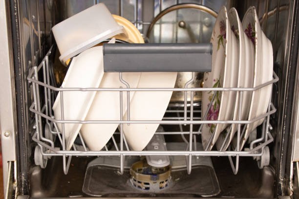 dirty dishes are in the dishwasher container, washing dishes