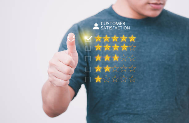 istock Satisfaction survey and customer service concept, businessman using a smartphone to answer the questionnaire and give a satisfaction rating, offering a 5-star satisfaction rating 1476112388