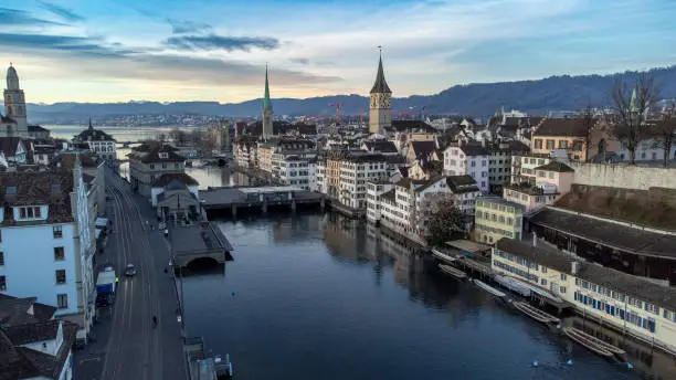 Scenisc shot of the sunrise in Zurich old town with view over the limmat to the lake with Fraumünster