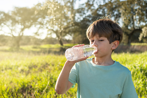 Beautiful Child Drink Water Outdoor