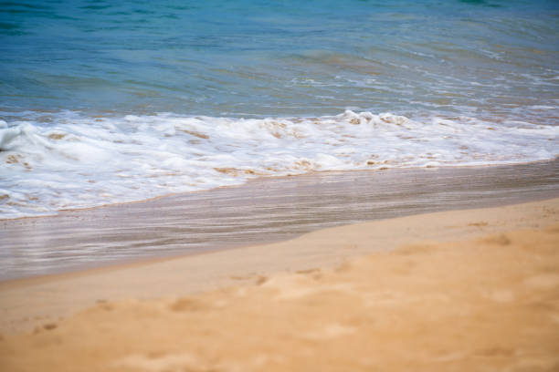 Splashing wave beach with sand and sea in phuket thailand