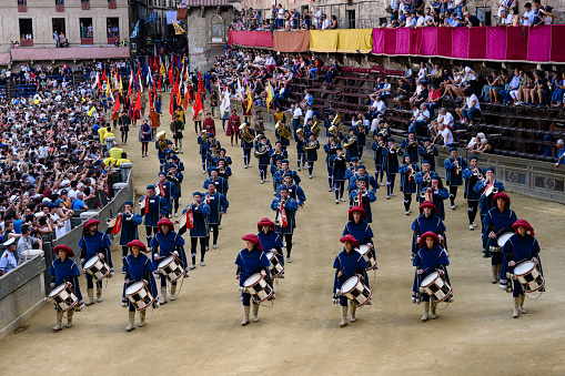 Siena, Italy - August 17 2021: Corteo Storico Historical Parade of the Palio di Siena with Musicians, Communal Drummers and Trumpeters and Members of the Musici del Palazzo Musicians wearing Historical Clothes.