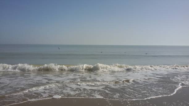 istock Light waves of the calm sea 1476129072