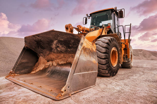 istock earth mover is loading gravel in railroad wagon at quarry site 1476140720