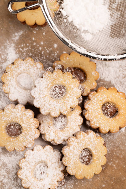 istock Baked cookies ready to get sugar powder on 1476141398