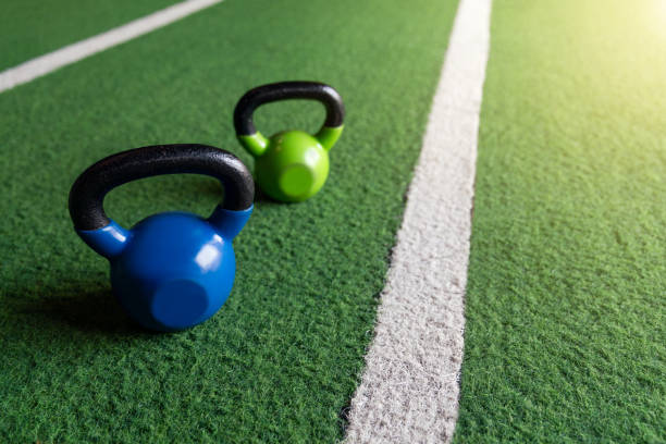istock Kettlebells on a grass floor in the gym. 1476141696
