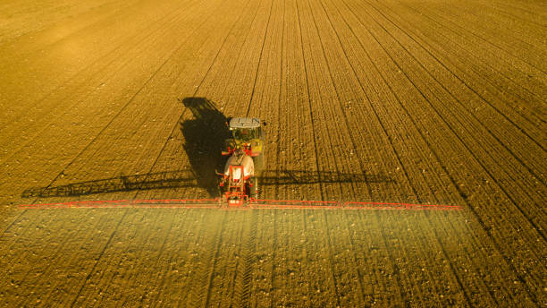 istock harvesting and soil treatment with farm machinery 1476144888