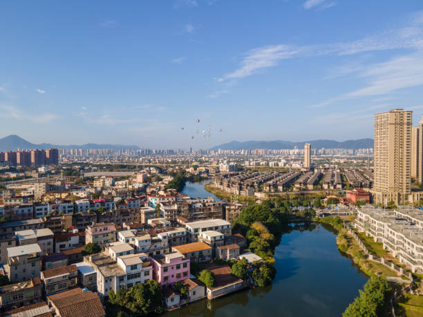 istock Urban buildings and villas by the river 1476151117
