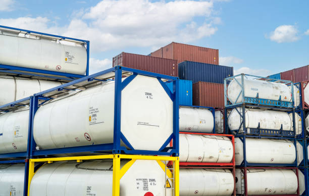 Chemical tank container. ISO tank container for chemical delivery. Bulk liquid transport. Chemical company. Container freight area. Global logistics business. Chemical container for truck transport. stock photo