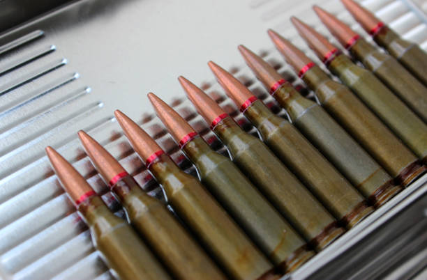 istock Live Ammunition In A One Row Laid Out On A Steel Surface Angle View 1476154593