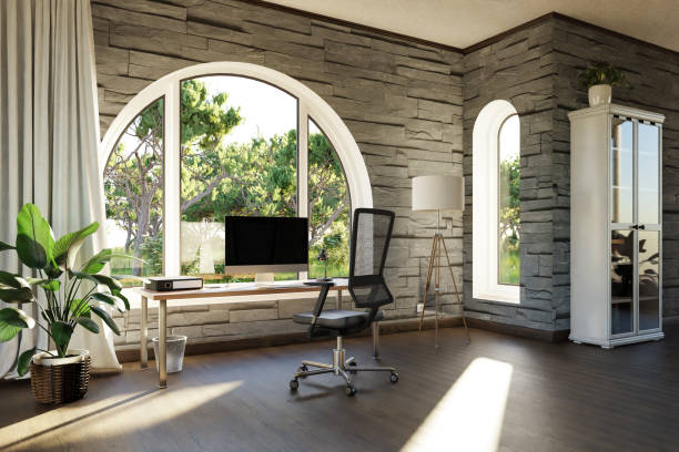 istock comfortable workplace with pc workstation standing in front of large arched windows; landscape view; bright sunlight shines through window; remote work freelance concept; 3D Illustration 1476156654