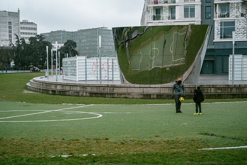 March 8th 2023, Nantes Brittany France: Locals playing football at a court at center in Nantes, which is one of the most popular cities to tourists in France.