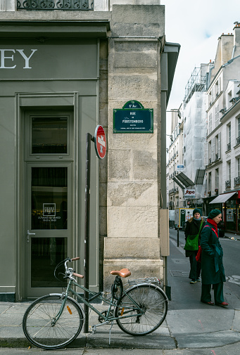 Paris,France,March 7th 2023: Locals walking past a shop at Saint-germain area in Paris.Saint-Germain area is famous to tourists for its chic and abundance of cafes, restaurants and galleries.