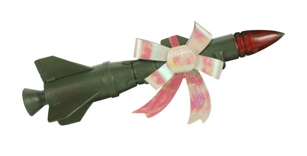 istock War missile rocket weapon with gift bow tie on it. Isolated on white background. Army combat drone bombing concept idea 1476162945