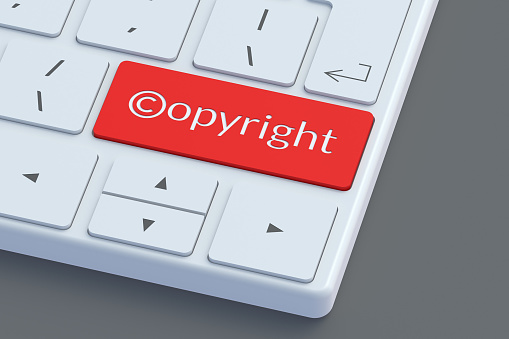 Copyright symbol and word on keyboard button. Intellectual property concept. Copyright of the music or song. 3d render