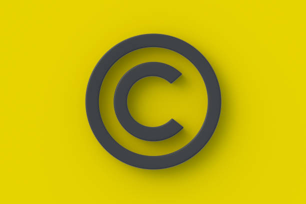 istock Black copyright symbol on yellow background. Intellectual property concept. Top view. 3d render 1476166508