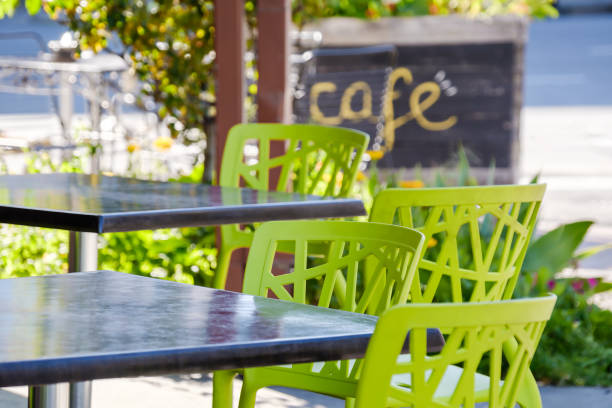 istock Colourful outdoor seating tables and chairs in cafe 1476166827