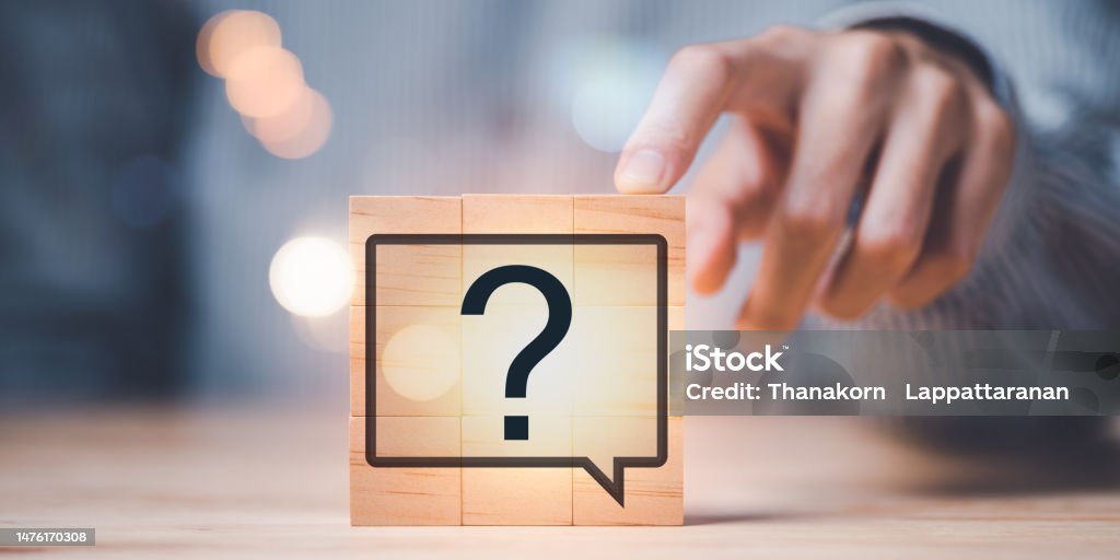 Question mark on wooden block, Questioning concepts, why, where, when, how, who ,to find the answer , and ask for help to solve the problem,Finding new solutions to solve business problems Advice Stock Photo
