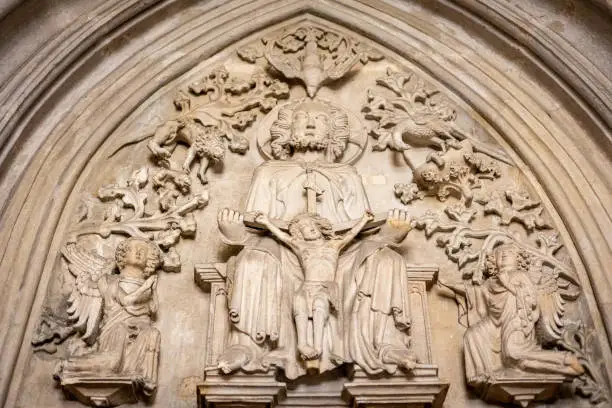 Photo of Gothic tympanum with God holding crucified Christ