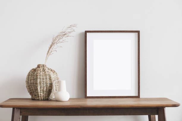 istock Artwork mockup in interior design. Blank picture frame on a wall. Vertical orientation 1476175021