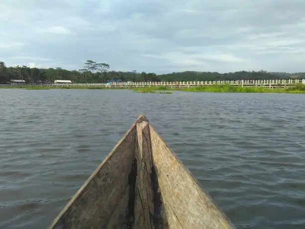 Point of view Rawa Pening (Rawapening) lake from traditional wooden boat head to Jembatan Biru bridge in Central Java, Indonesia