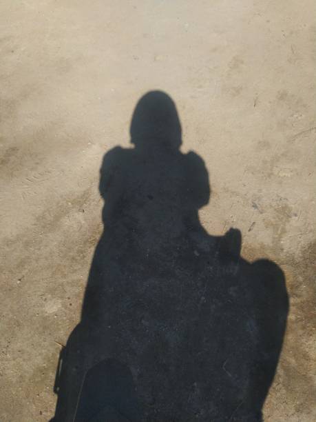 istock The shadow of a man in a barren desert 1476187624