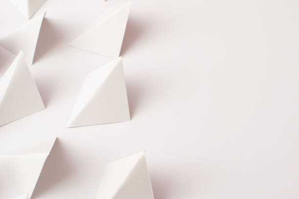istock Close up 3d white triangle shapes on white background with empty space 1476188506