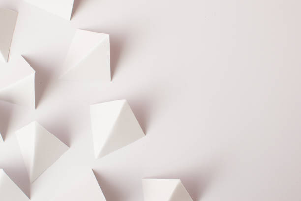 istock White geometric shapes on white background with copy space 1476188631