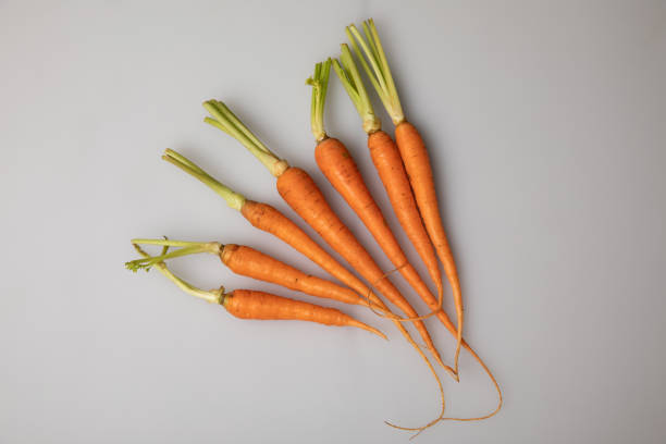 istock A group of carrots is placed on a white background 1476192032